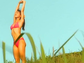 Lovely Aki Takajo posing in a pink bikini